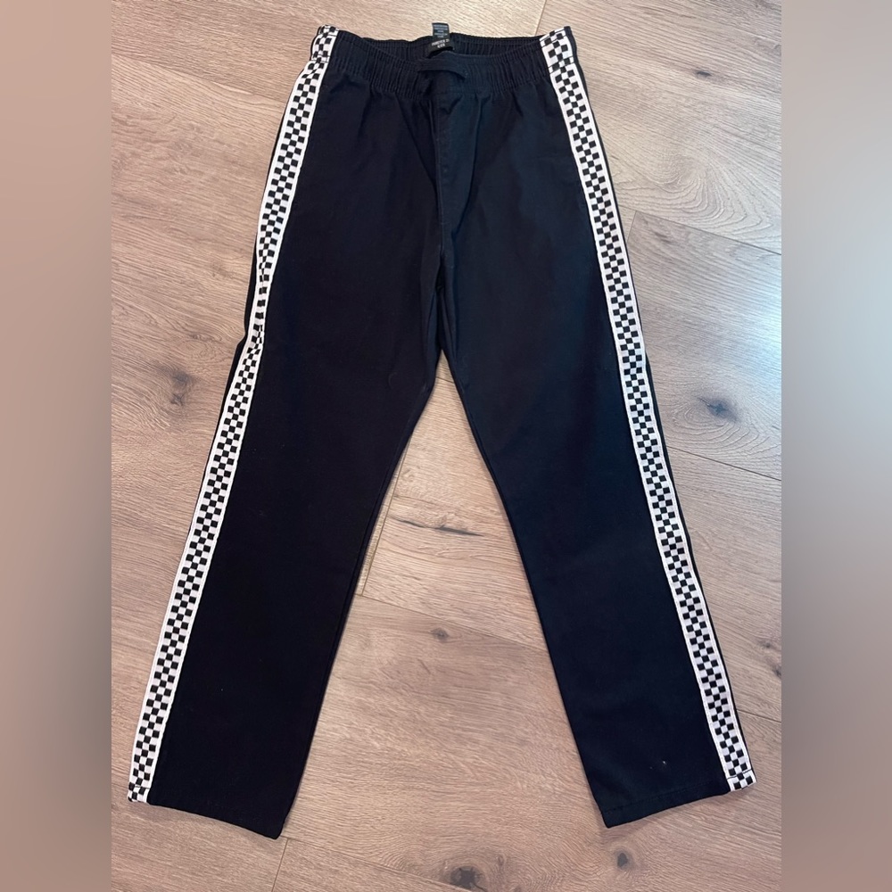 Black pants with Skechers.